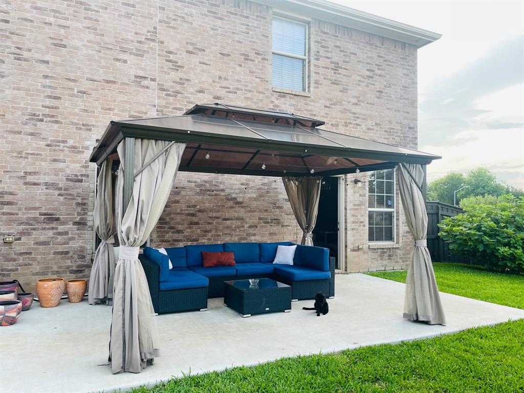 516 Angela Lane Euless, TX 76039 - Photo 36 of 39 View of patio / terrace featuring a gazebo and an outdoor hangout area