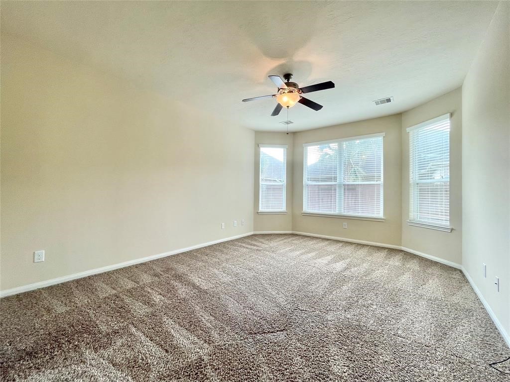 25015 Diamond Ranch Drive Katy, TX 77494 - Photo 13 of 27 a view of an empty room with a window