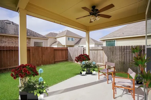 a front view of a house with a garden and plants
