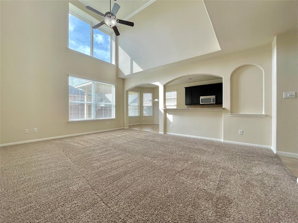 25015 Diamond Ranch Drive Katy, TX 77494 - Photo 6 of 27 an empty room with windows and fireplace