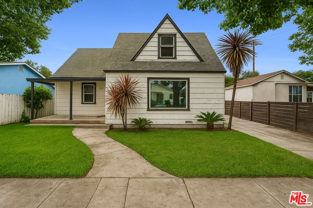 312 East Peace Street Long Beach, CA 90805 - Photo 1 of 39 a front view of a house with a garden