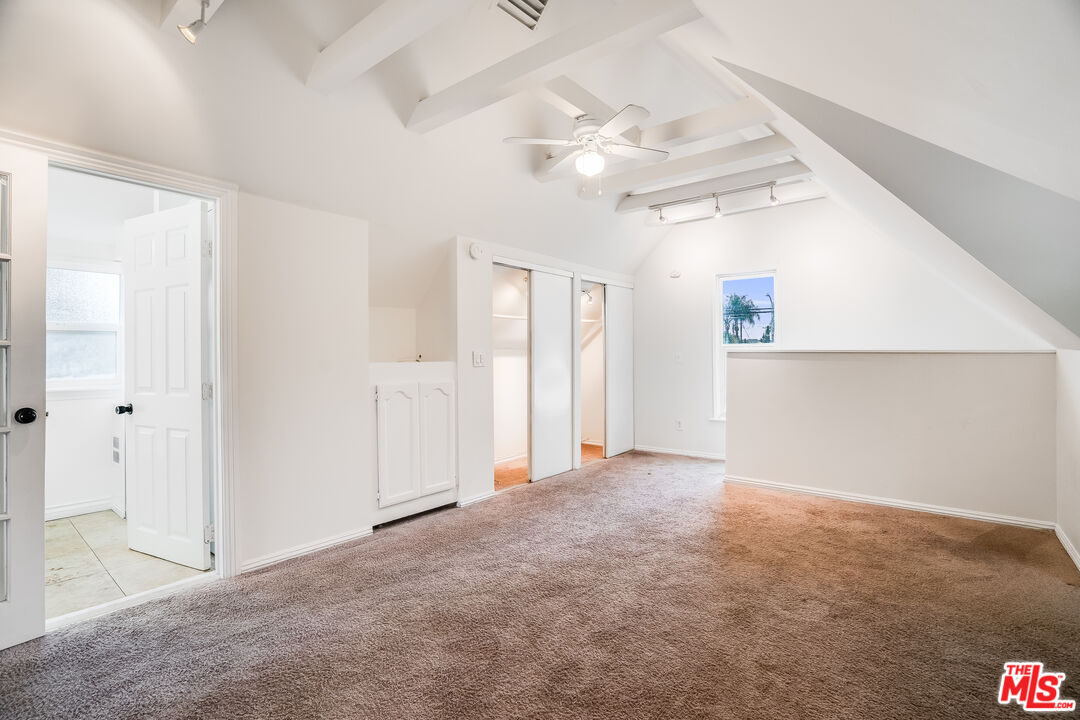 312 East Peace Street Long Beach, CA 90805 - Photo 20 of 39 en empty room with windows and ceiling fan