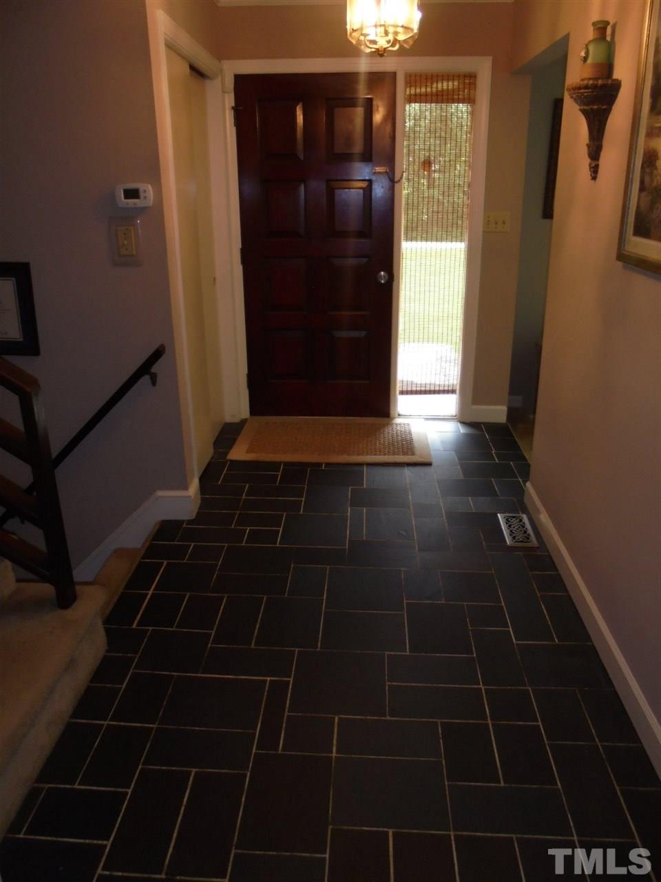 182 Dyking Road Louisburg, NC 27549 - Photo 11 of 25 Front door opens up to this foyer with tile flooring. From this area the lower level, upper level, living room, and family room are accessible!