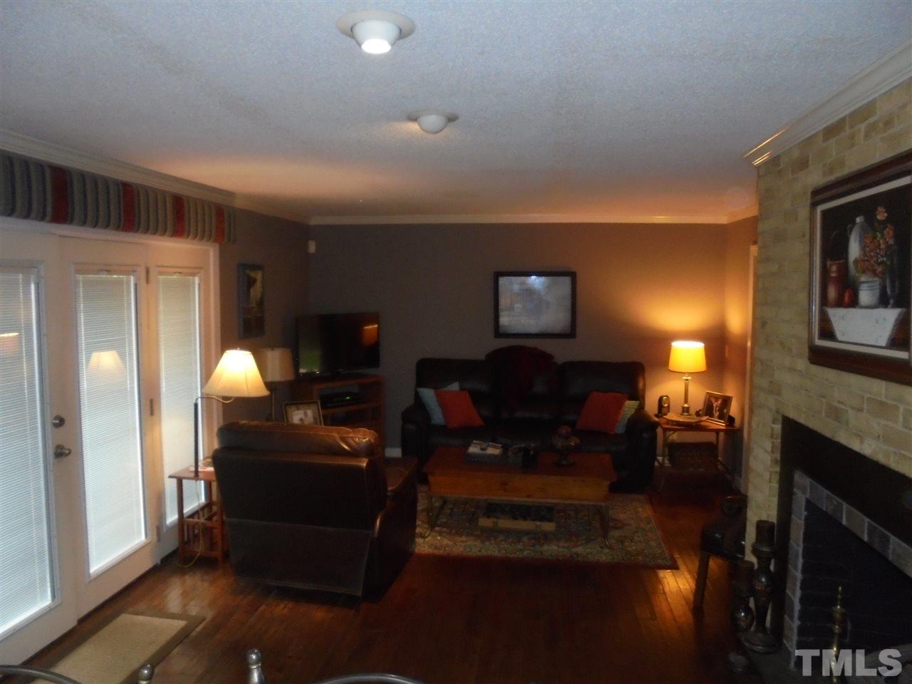 182 Dyking Road Louisburg, NC 27549 - Photo 4 of 25 Family Room with fireplace overlooks the spacious backyard! 3/4" maple hardwood flooring!
