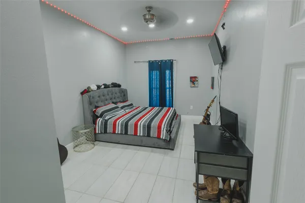 a bedroom with a bed and a couch