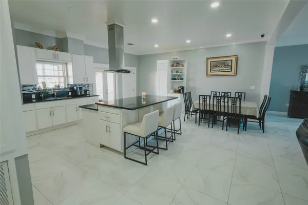 a bathroom with a sink mirror and toilet