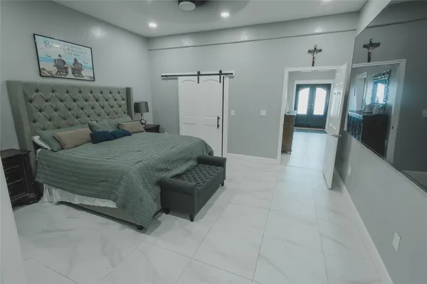 a view of walk in closet with clothes