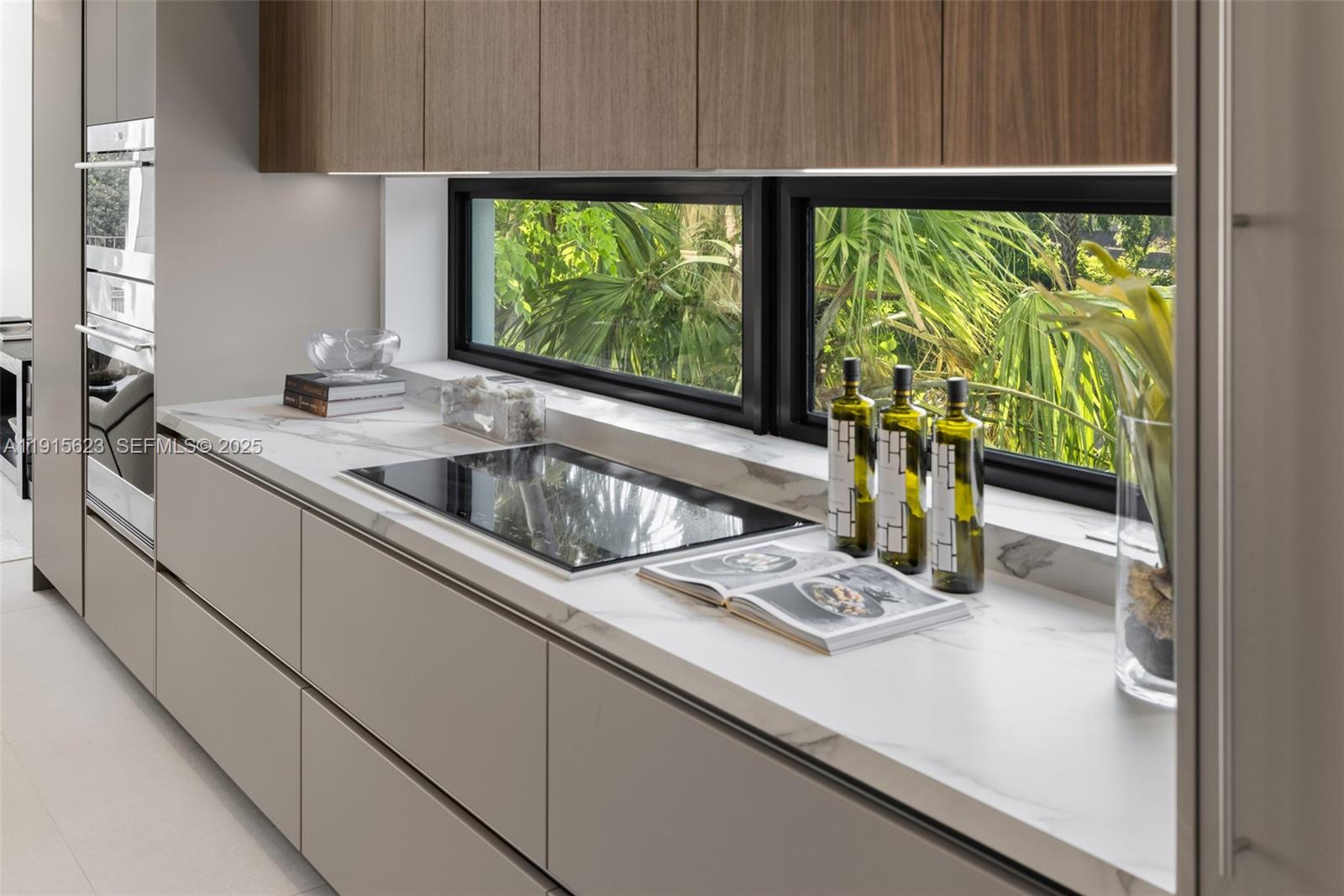 94 Southwest 28th Road, Unit 3 Miami, FL 33129 - Photo 11 of 33 a kitchen with a sink and a window