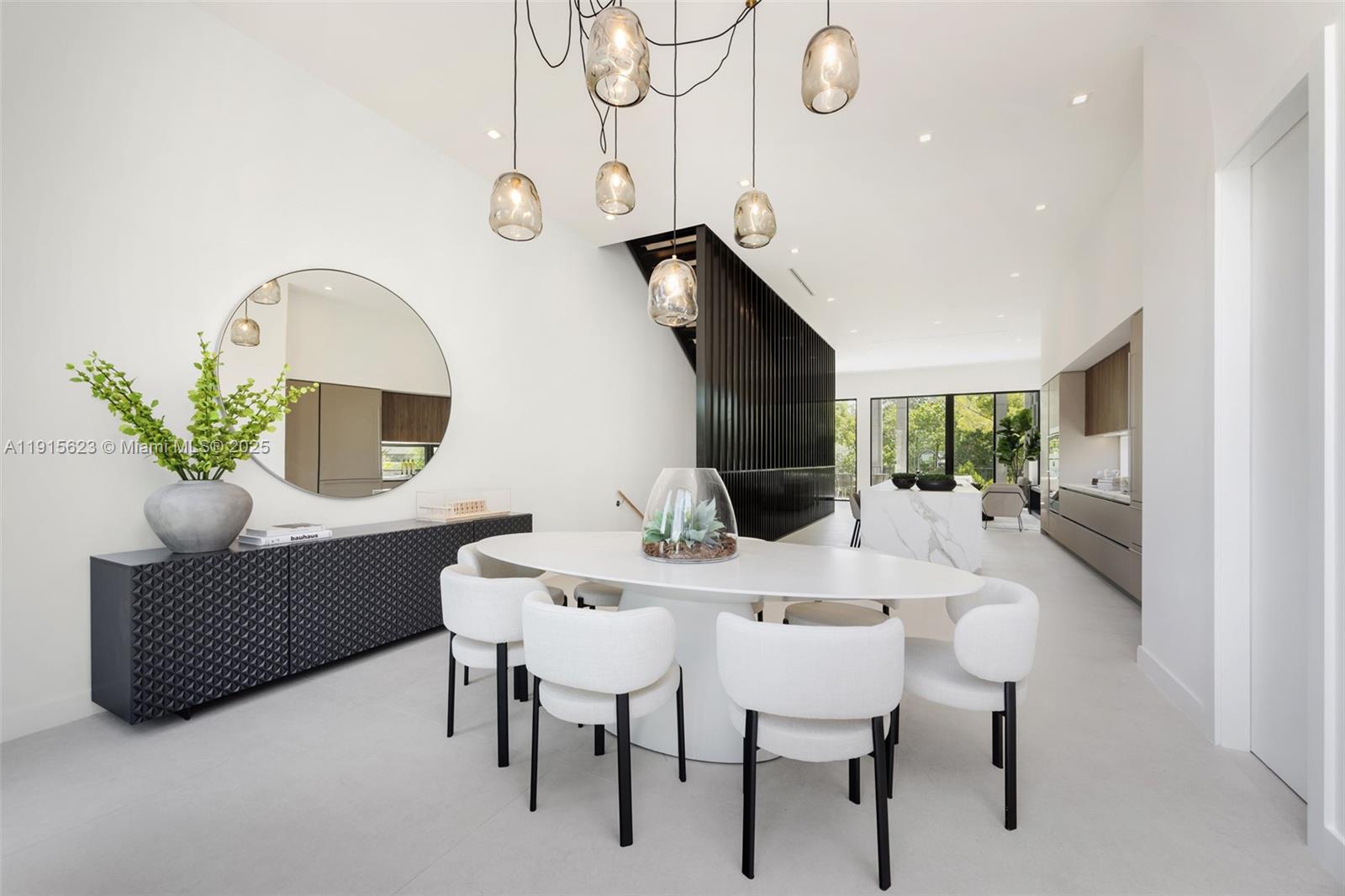 94 Southwest 28th Road, Unit 3 Miami, FL 33129 - Photo 12 of 33 a view of a dining room with furniture and wooden floor
