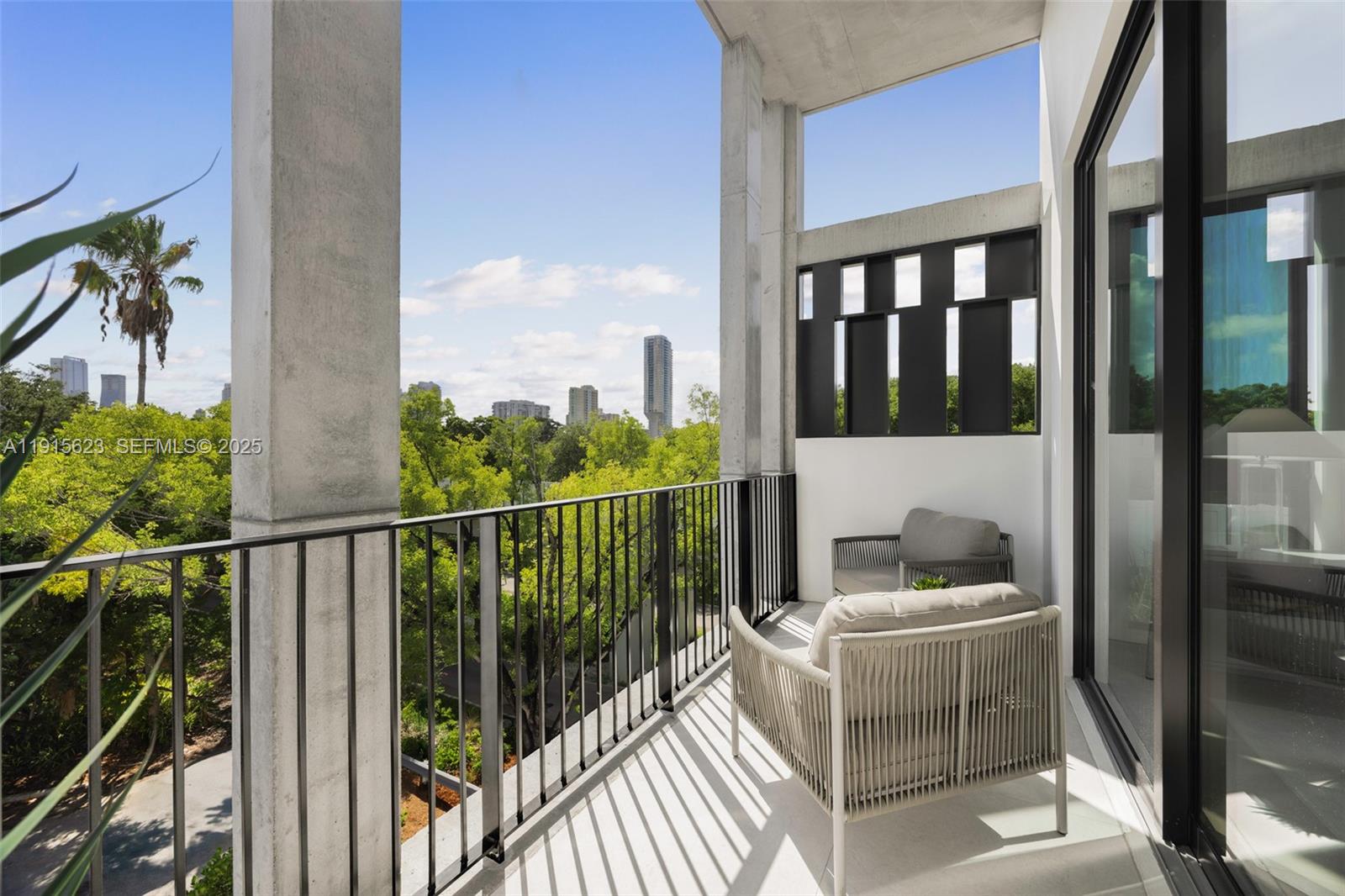 94 Southwest 28th Road, Unit 3 Miami, FL 33129 - Photo 21 of 33 a view of a balcony with furniture