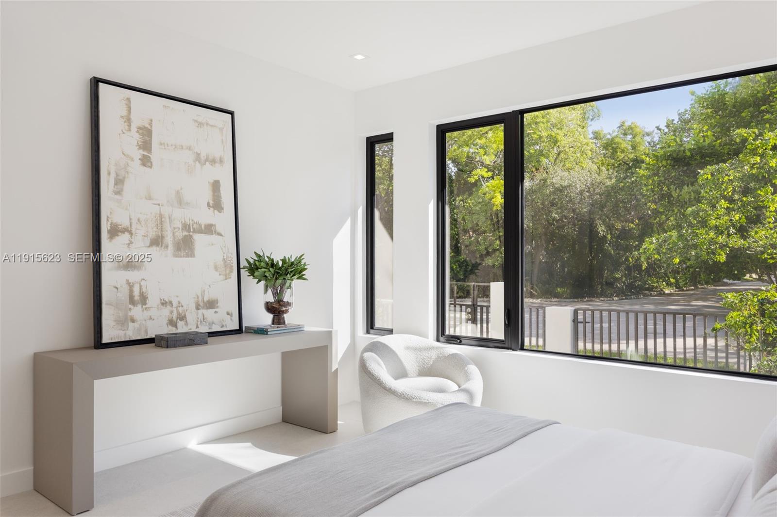 94 Southwest 28th Road, Unit 3 Miami, FL 33129 - Photo 23 of 33 a living room with furniture and a floor to ceiling window