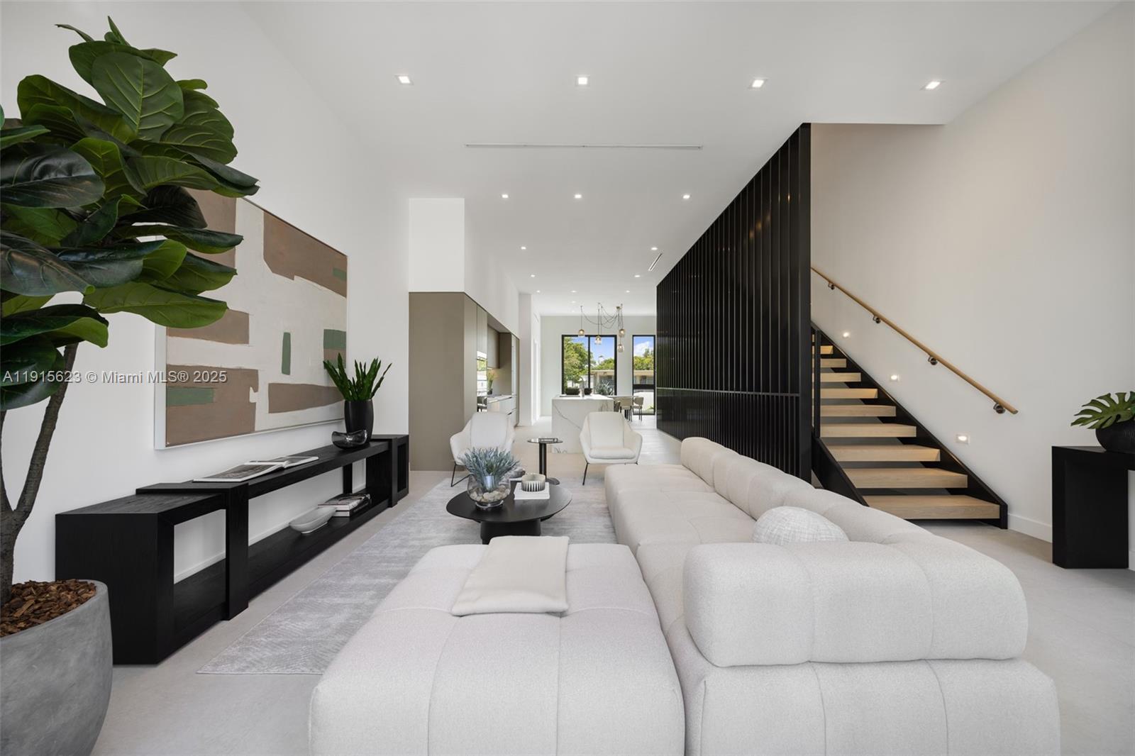 94 Southwest 28th Road, Unit 3 Miami, FL 33129 - Photo 6 of 33 a living room with furniture and a potted plant