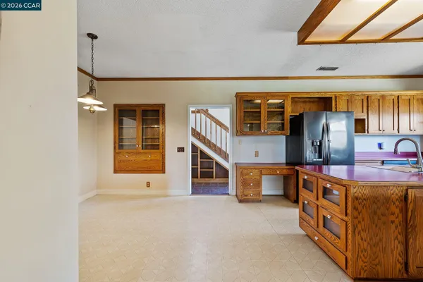 a kitchen with stainless steel appliances granite countertop a stove and a sink