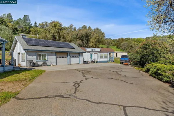 a view of a house with a big yard