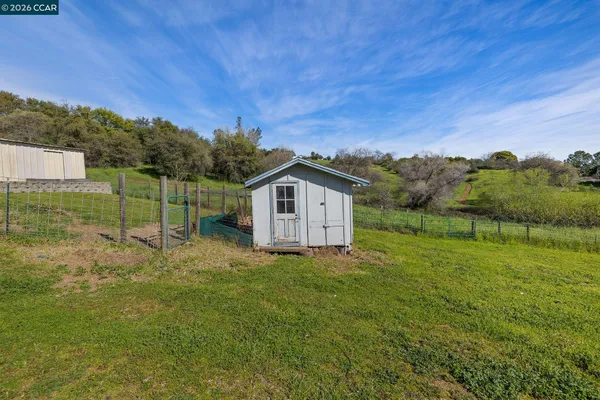a aerial view of a house with a yard