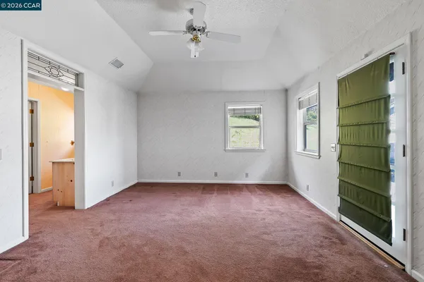 a view of an empty room with a window