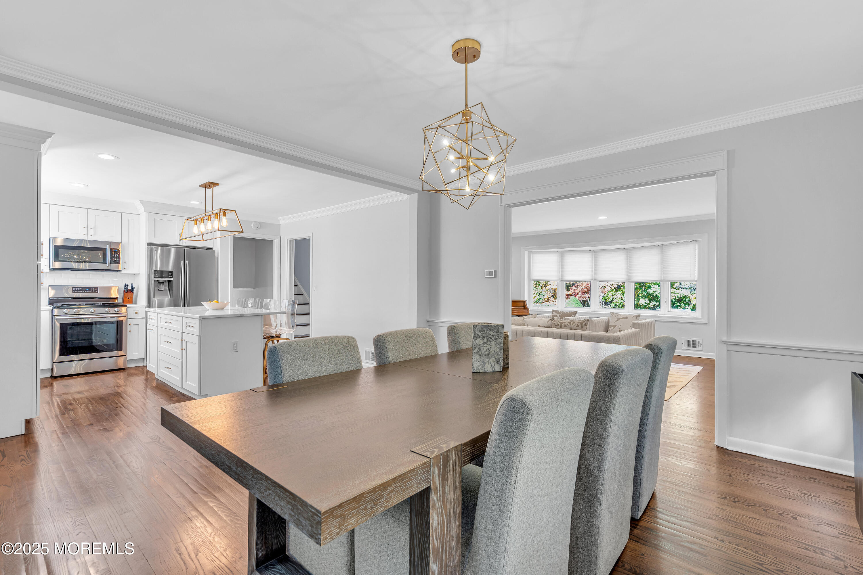67 Beverly Road Springfield, NJ 07081 - Photo 12 of 46 a view of a dining room with furniture and wooden floor