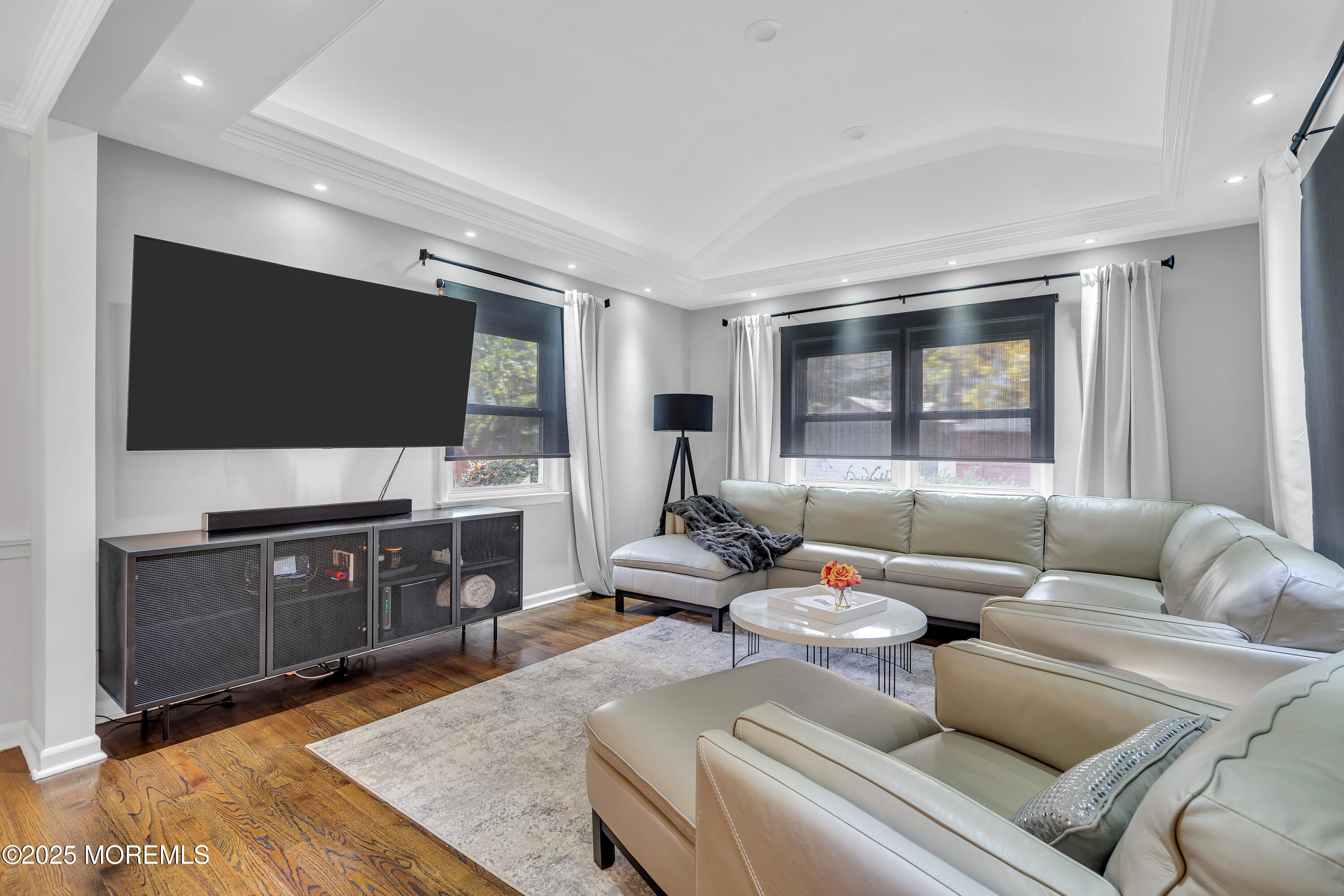 67 Beverly Road Springfield, NJ 07081 - Photo 15 of 46 a living room with furniture and a flat screen tv