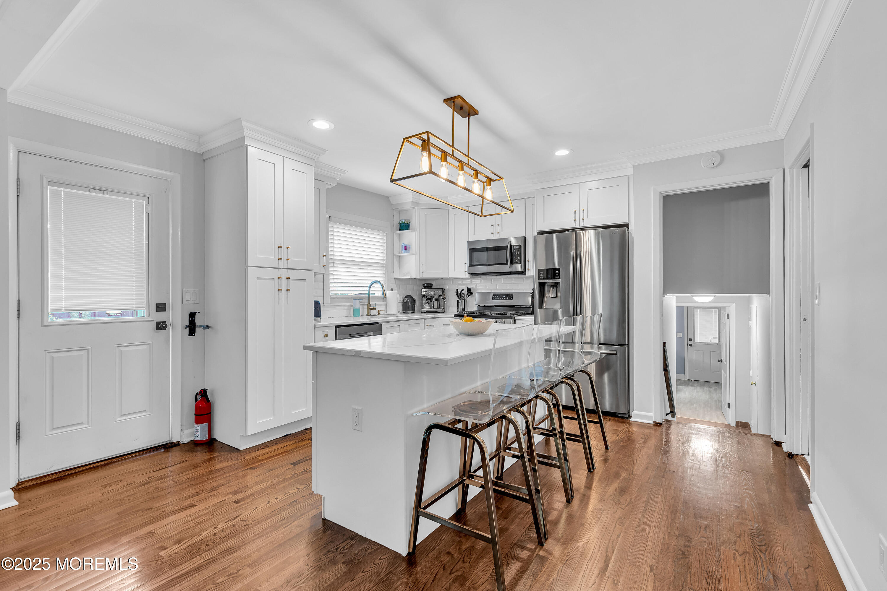67 Beverly Road Springfield, NJ 07081 - Photo 19 of 46 a kitchen view with stainless steel appliances a refrigerator and wooden floor