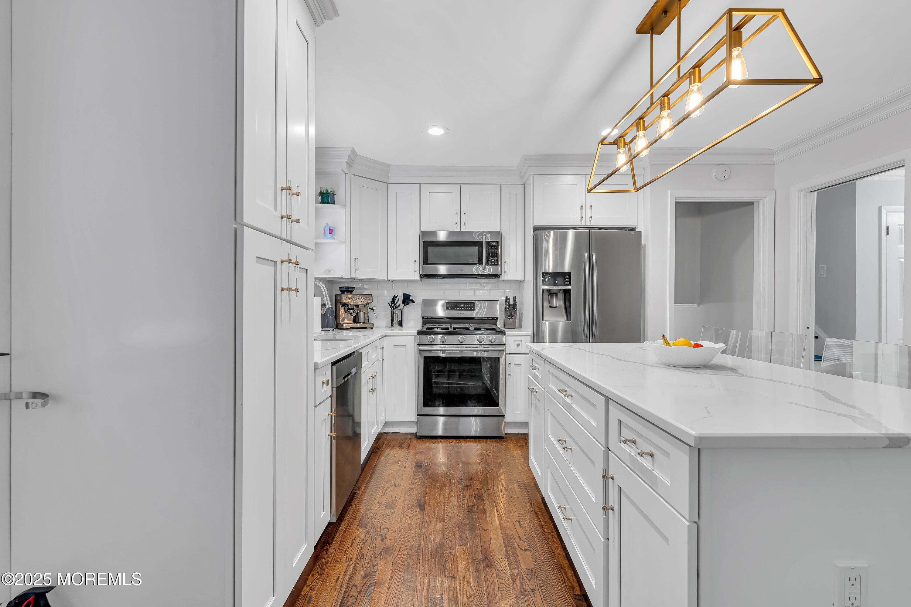 67 Beverly Road Springfield, NJ 07081 - Photo 22 of 46 a kitchen with kitchen island a stove a sink and a refrigerator