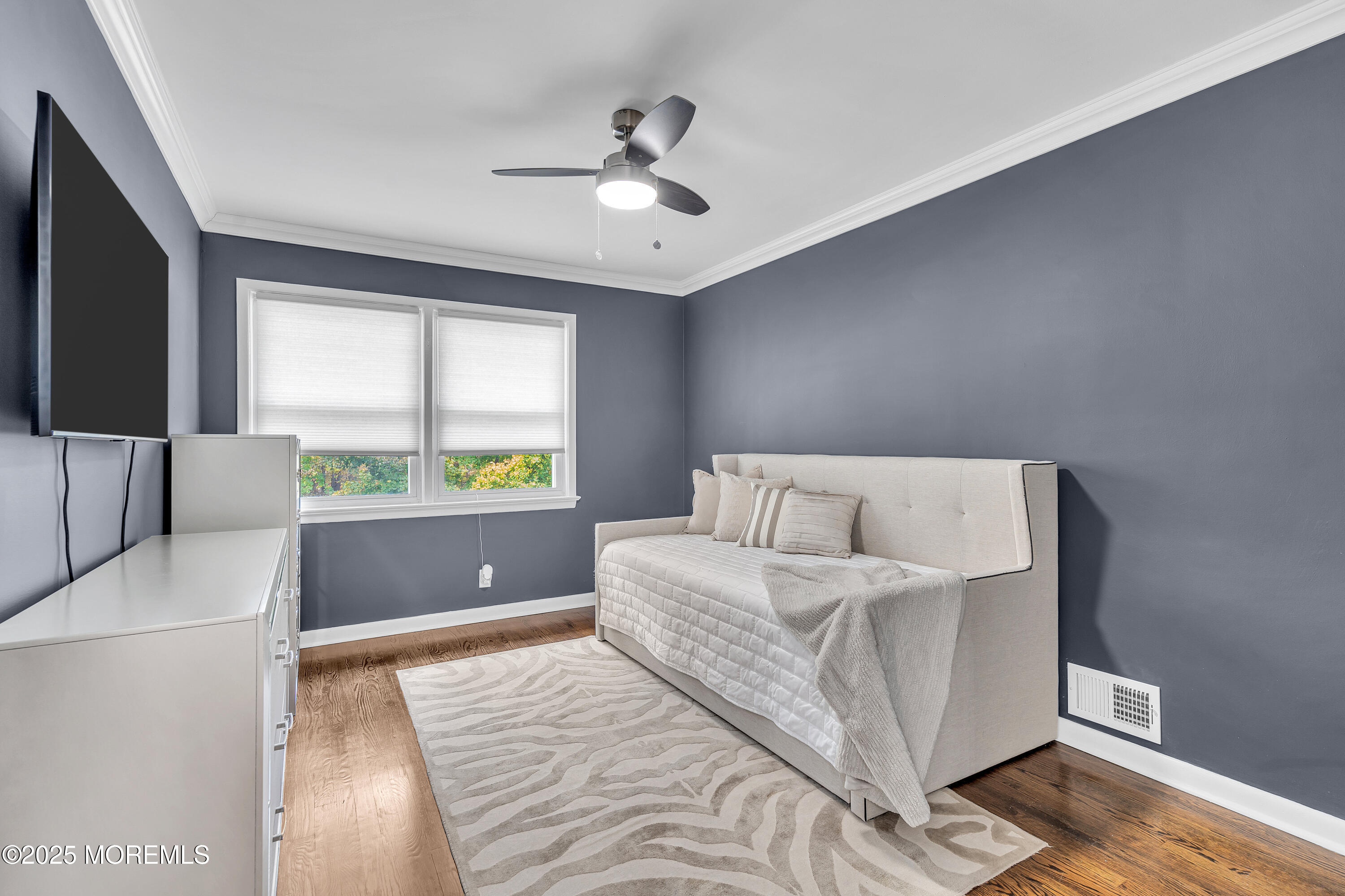 67 Beverly Road Springfield, NJ 07081 - Photo 26 of 46 a bedroom with a large bed and a flat screen tv