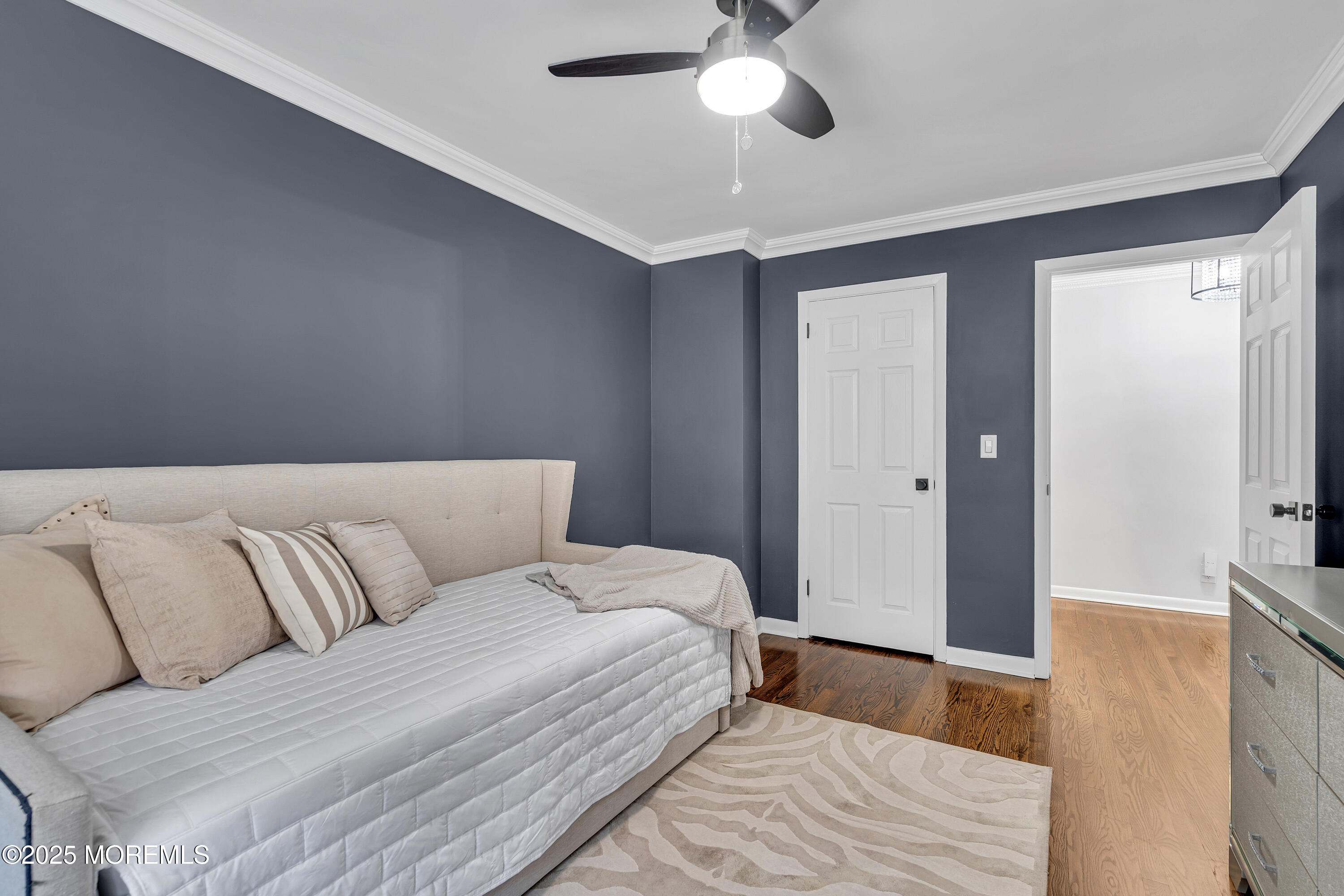 67 Beverly Road Springfield, NJ 07081 - Photo 27 of 46 a bedroom with a large bed and ceiling fan