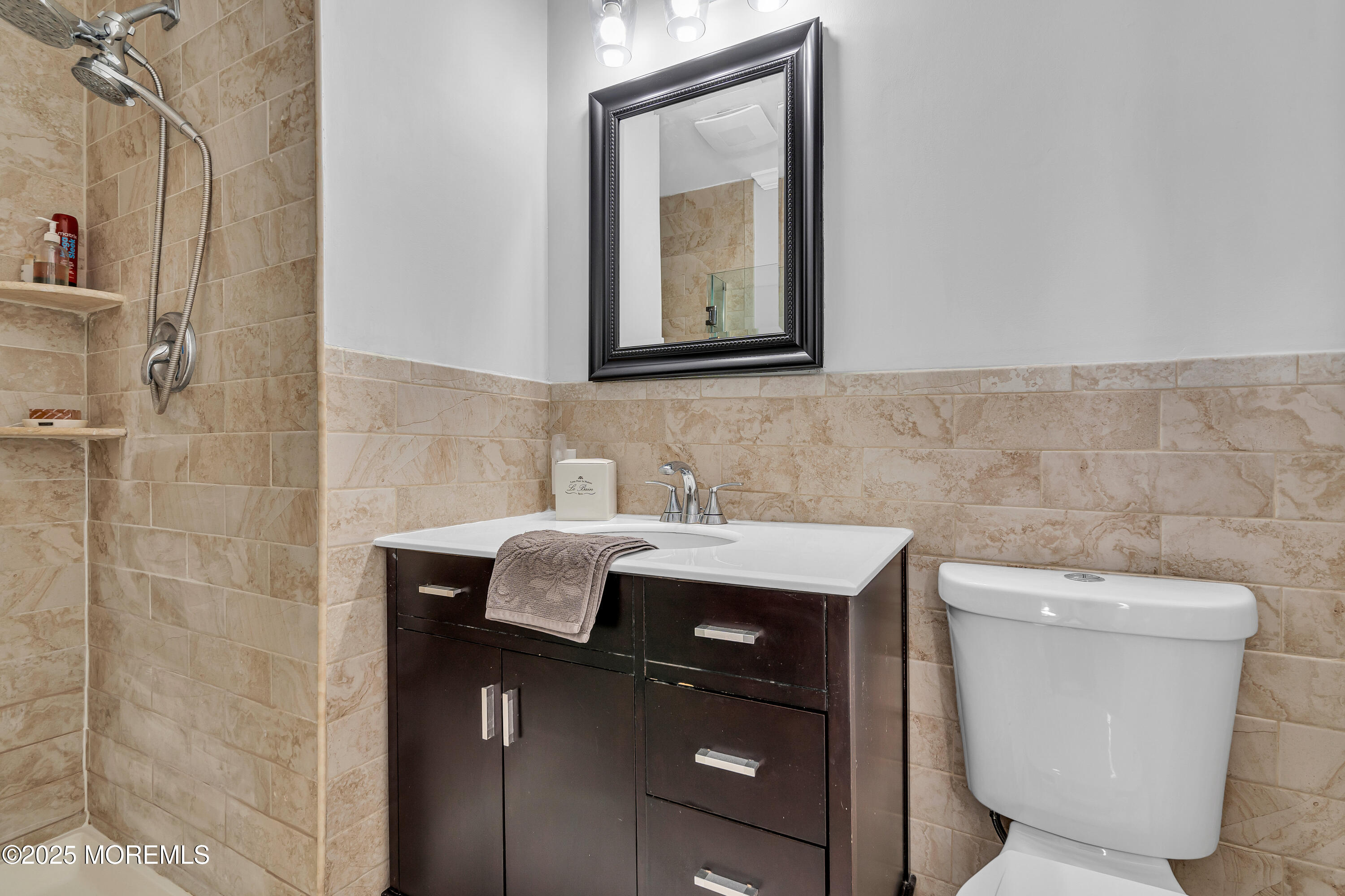 67 Beverly Road Springfield, NJ 07081 - Photo 30 of 46 a bathroom with a toilet sink and mirror