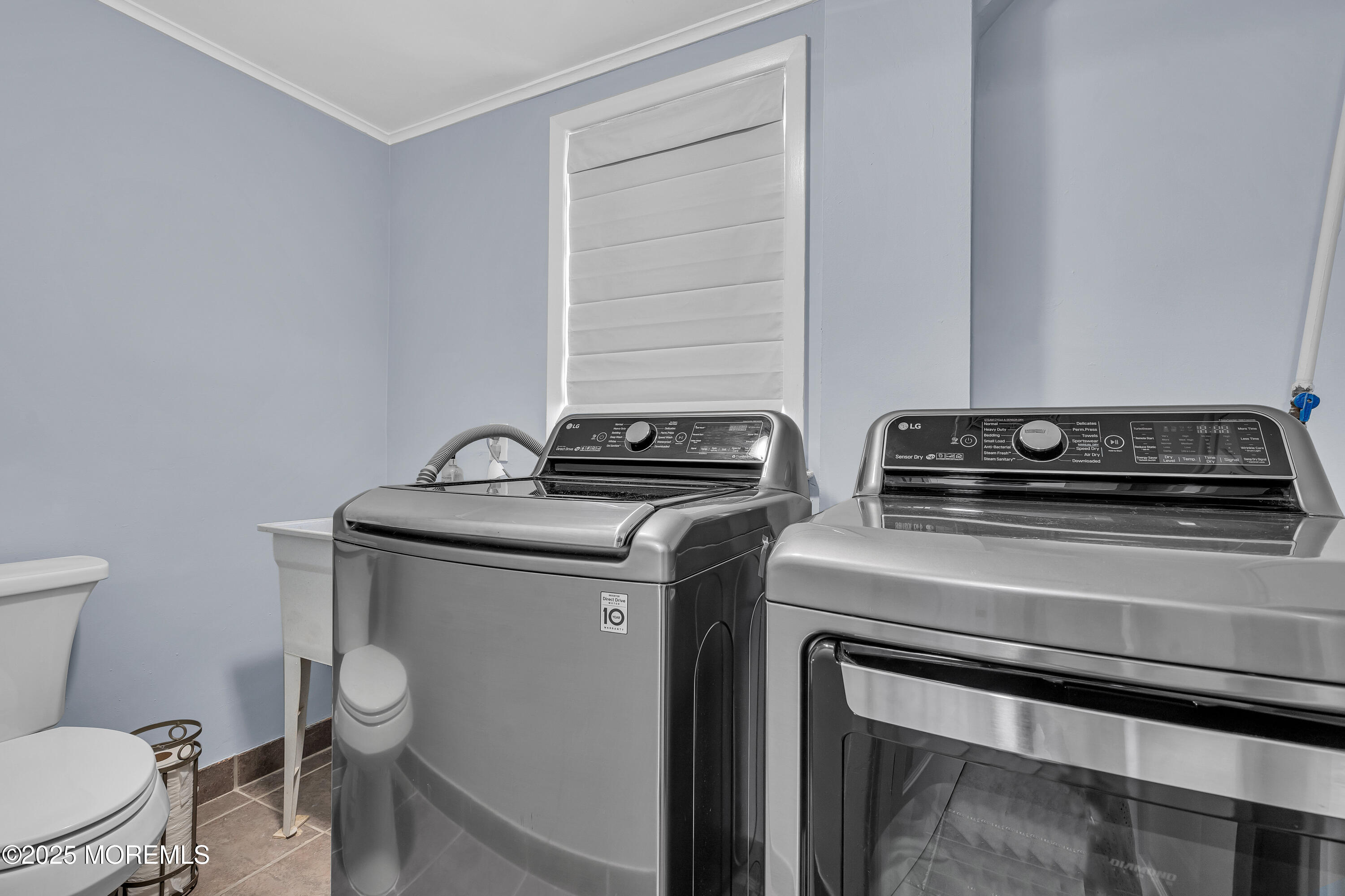 67 Beverly Road Springfield, NJ 07081 - Photo 33 of 46 a utility room with dryer and washer