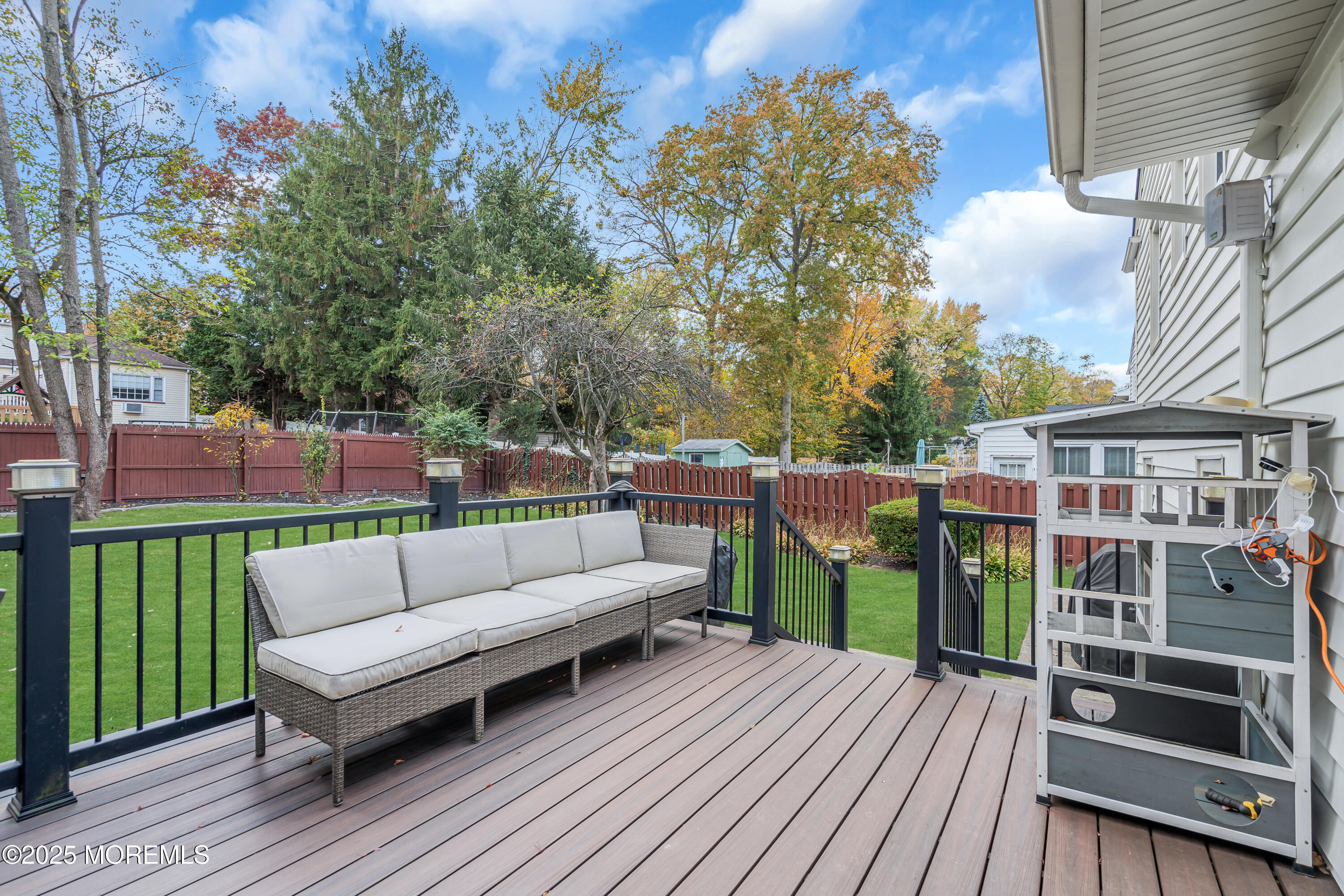 67 Beverly Road Springfield, NJ 07081 - Photo 40 of 46 a view of a deck with couches with wooden floor and fence
