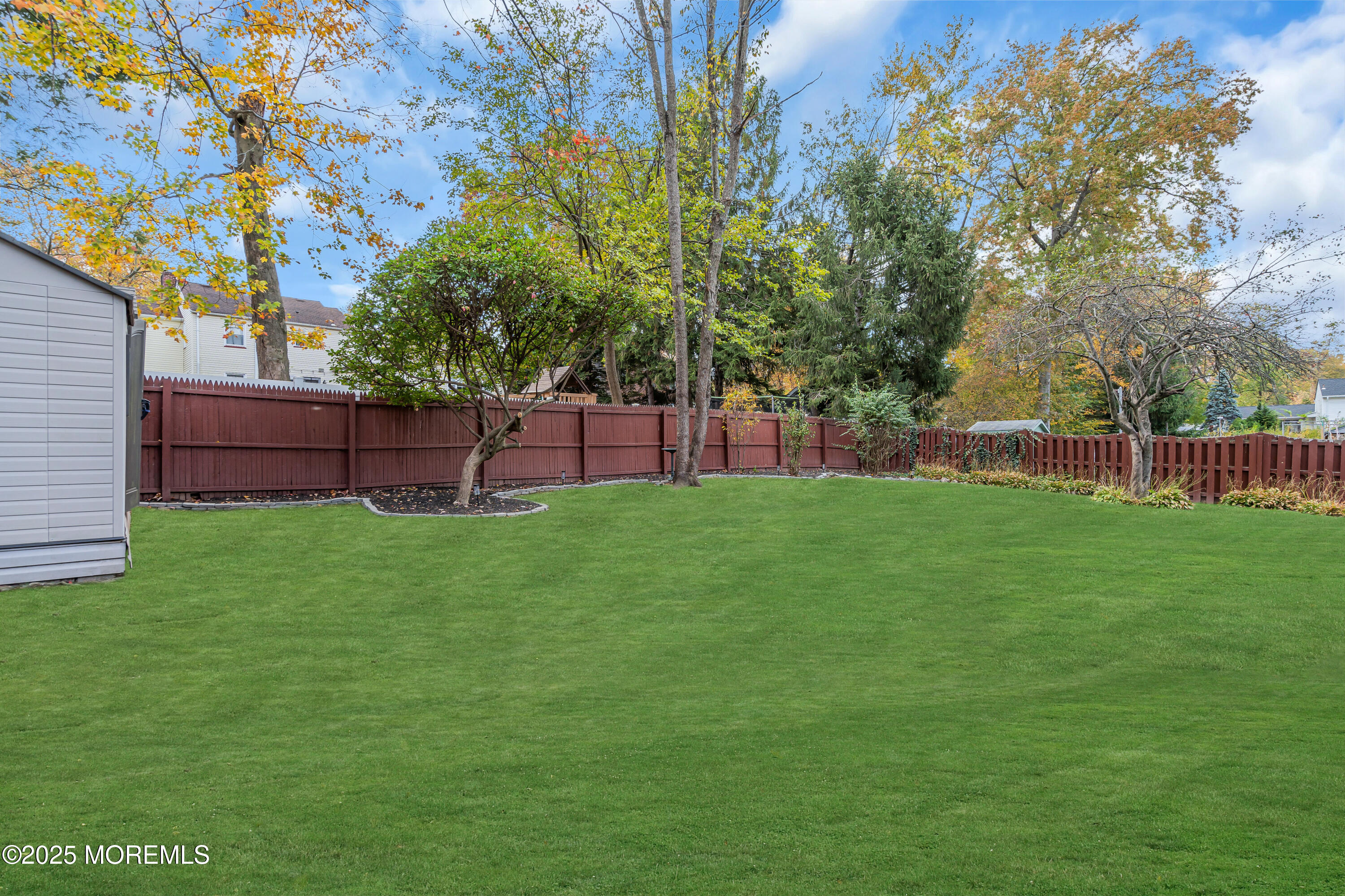 67 Beverly Road Springfield, NJ 07081 - Photo 43 of 46 a view of yard with green space and wooden fence