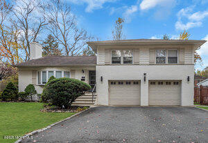 67 Beverly Road Springfield, NJ 07081 - Photo 46 of 46 a front view of a house with a garden and plants