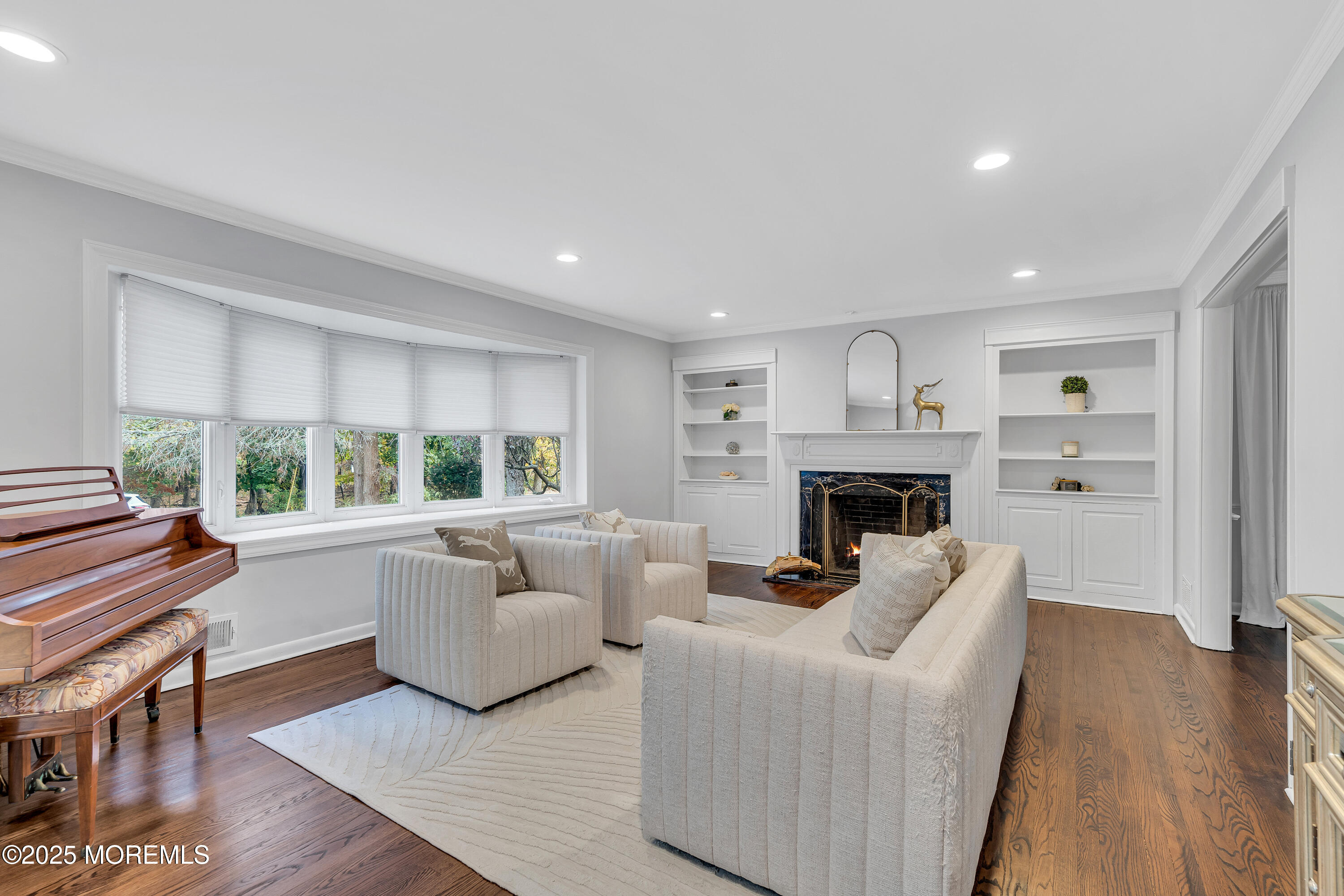 67 Beverly Road Springfield, NJ 07081 - Photo 6 of 46 a living room with furniture fireplace and a large window