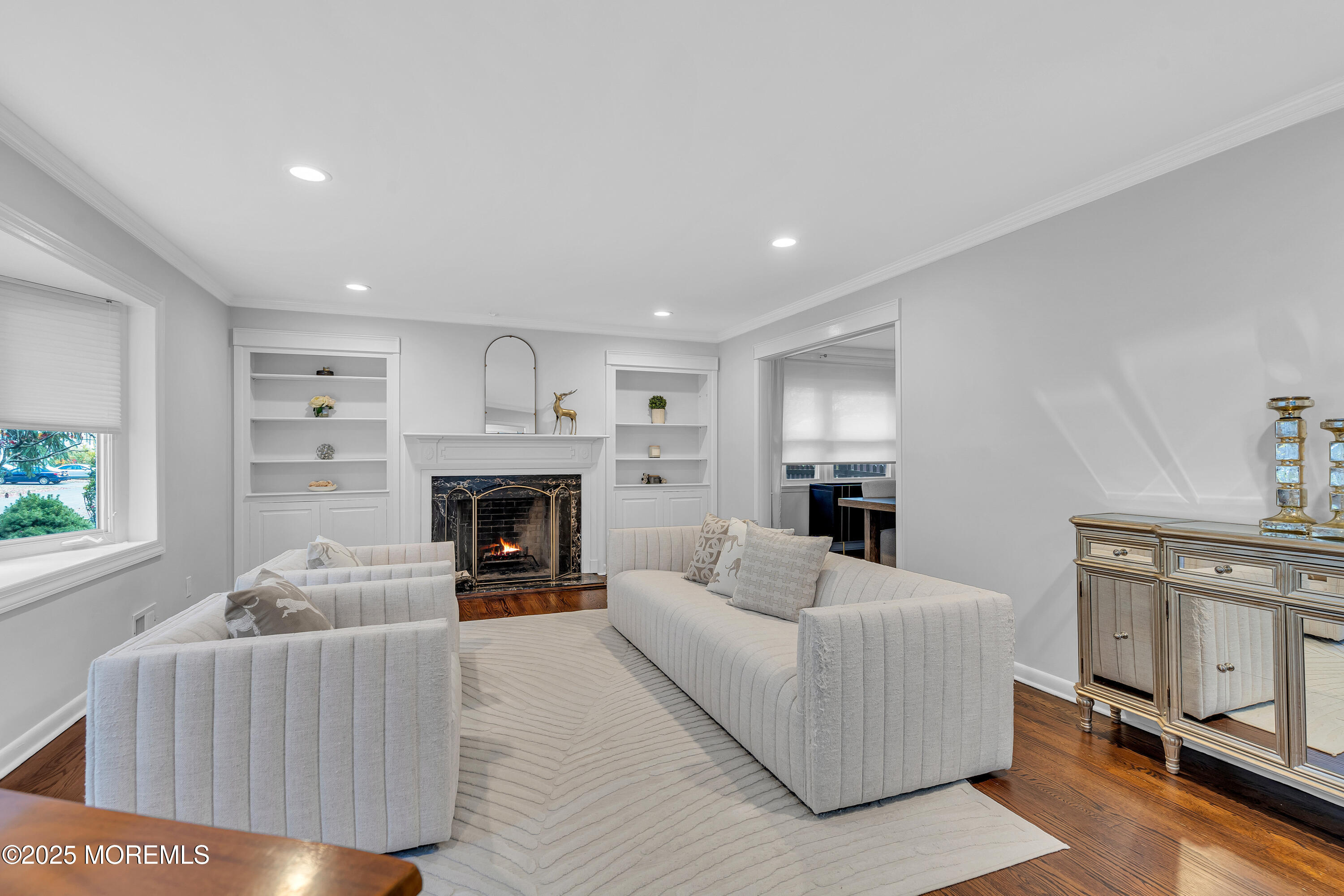 67 Beverly Road Springfield, NJ 07081 - Photo 7 of 46 a living room with furniture a fireplace and a window
