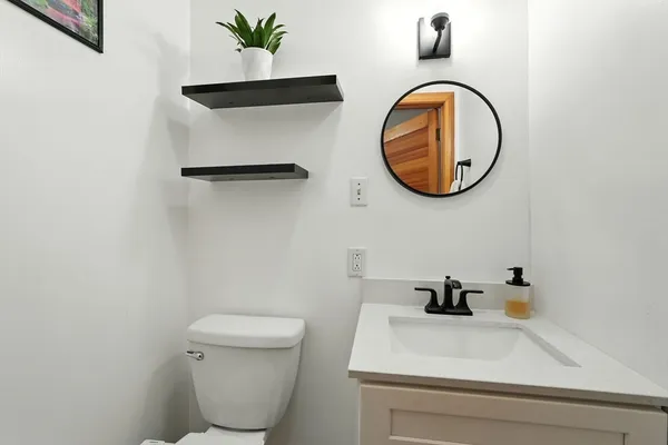 a bathroom with a toilet and a sink