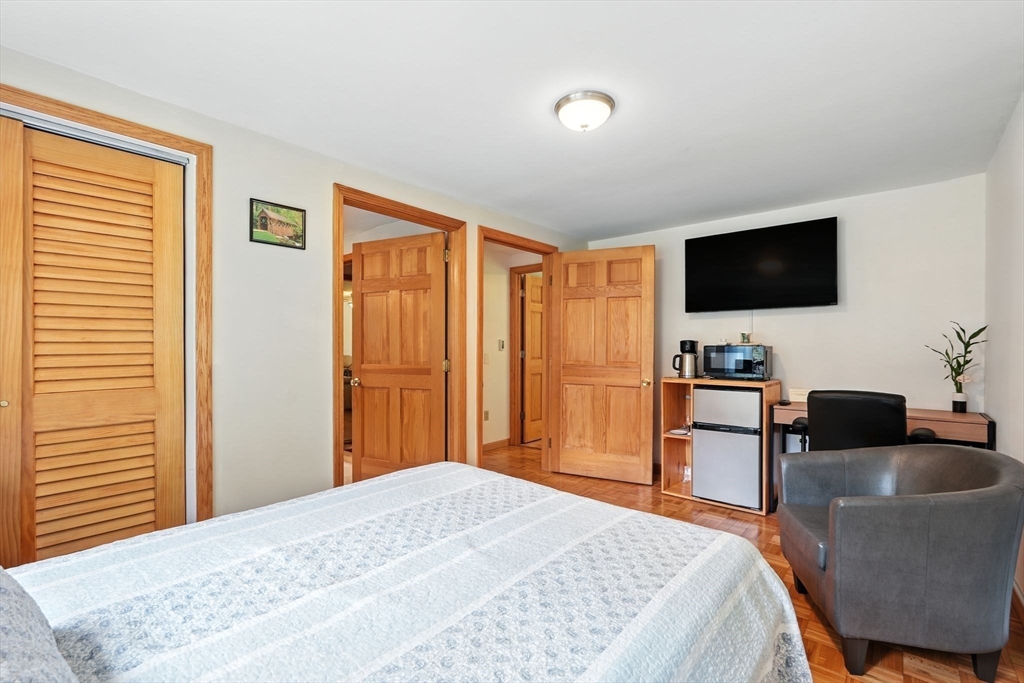 178 West Pomeroy Lane Amherst, MA 01002 - Photo 13 of 34 a bedroom with a bed and a flat screen tv