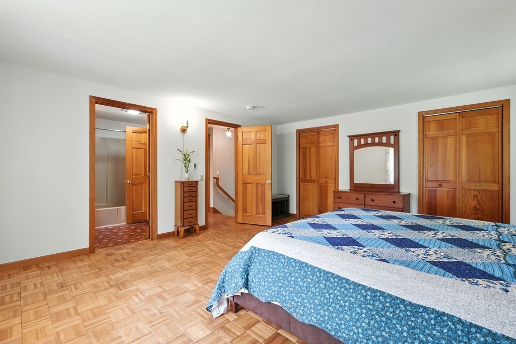 178 West Pomeroy Lane Amherst, MA 01002 - Photo 15 of 34 a bedroom with a large bed and a dresser