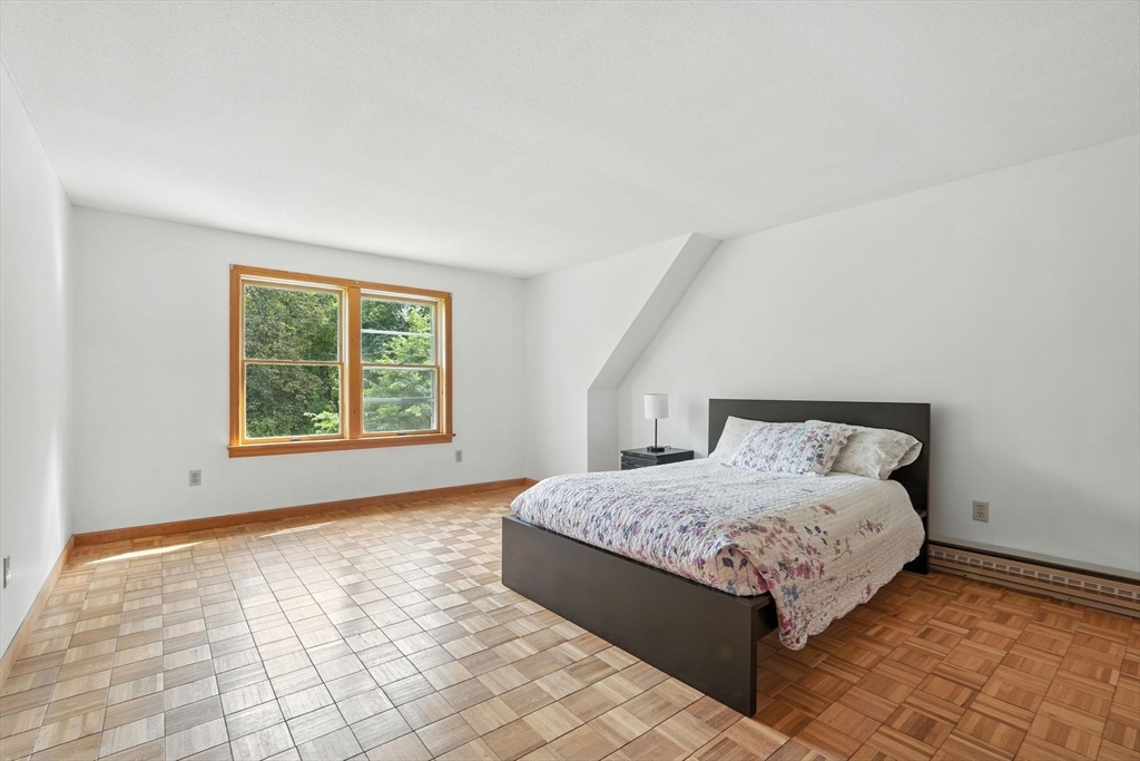 178 West Pomeroy Lane Amherst, MA 01002 - Photo 16 of 34 a bedroom with a bed and a window