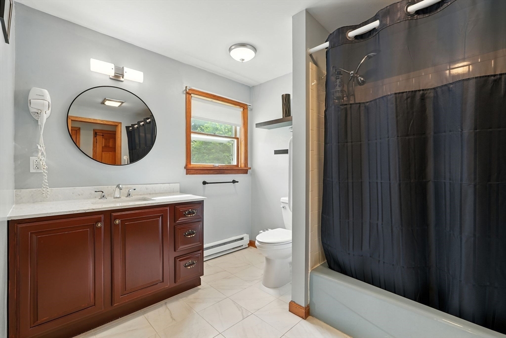 178 West Pomeroy Lane Amherst, MA 01002 - Photo 17 of 34 a bathroom with a toilet a sink and mirror