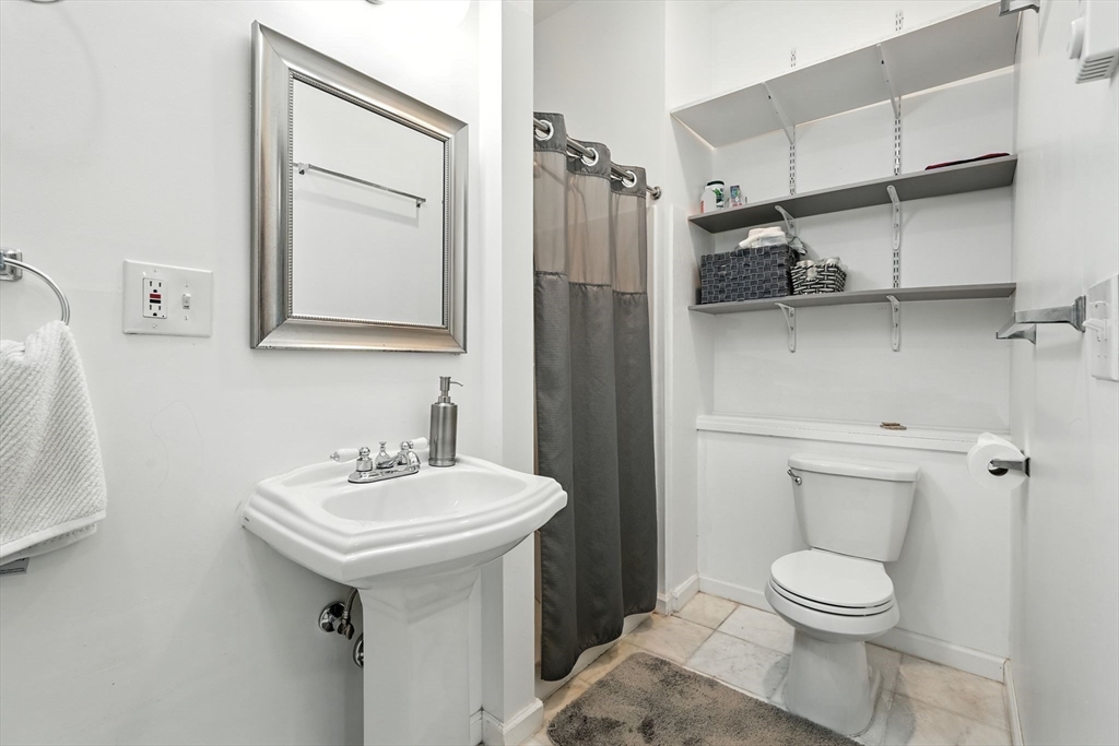 178 West Pomeroy Lane Amherst, MA 01002 - Photo 24 of 34 a white toilet sitting next to a bathroom sink
