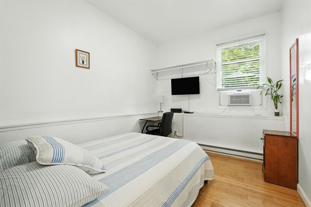 178 West Pomeroy Lane Amherst, MA 01002 - Photo 28 of 34 a bedroom with a bed and a flat screen tv