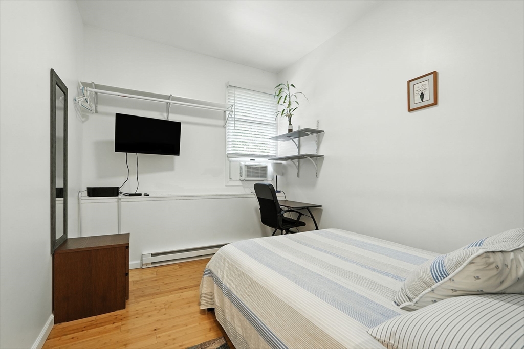 178 West Pomeroy Lane Amherst, MA 01002 - Photo 29 of 34 a bedroom with a bed and a flat screen tv