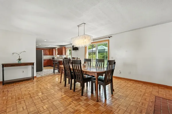 a dining room with furniture and window