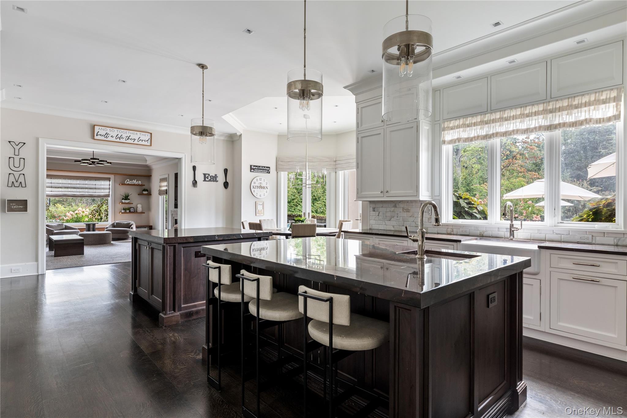 53 Simonson Road Glen Head, NY 11545 - Photo 19 of 43 a dining hall with stainless steel appliances granite countertop a sink a window and chairs