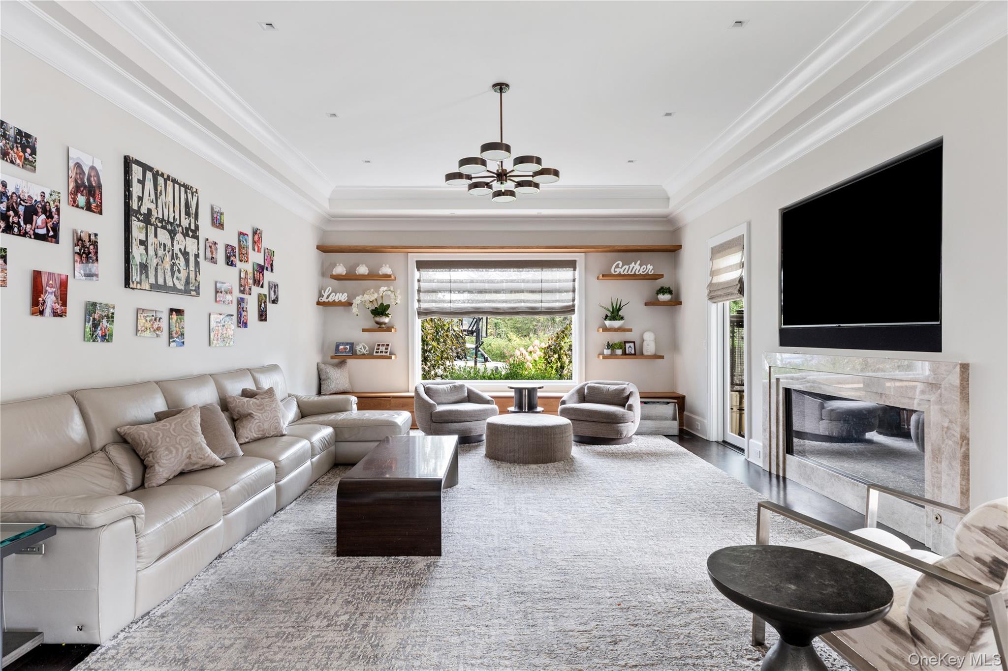 53 Simonson Road Glen Head, NY 11545 - Photo 20 of 43 a living room with furniture fireplace and flat screen tv
