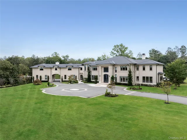 an aerial view of a houses with a yard
