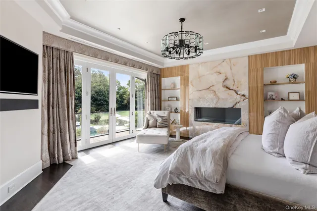 a view of a patio with a table and chairs under an umbrella