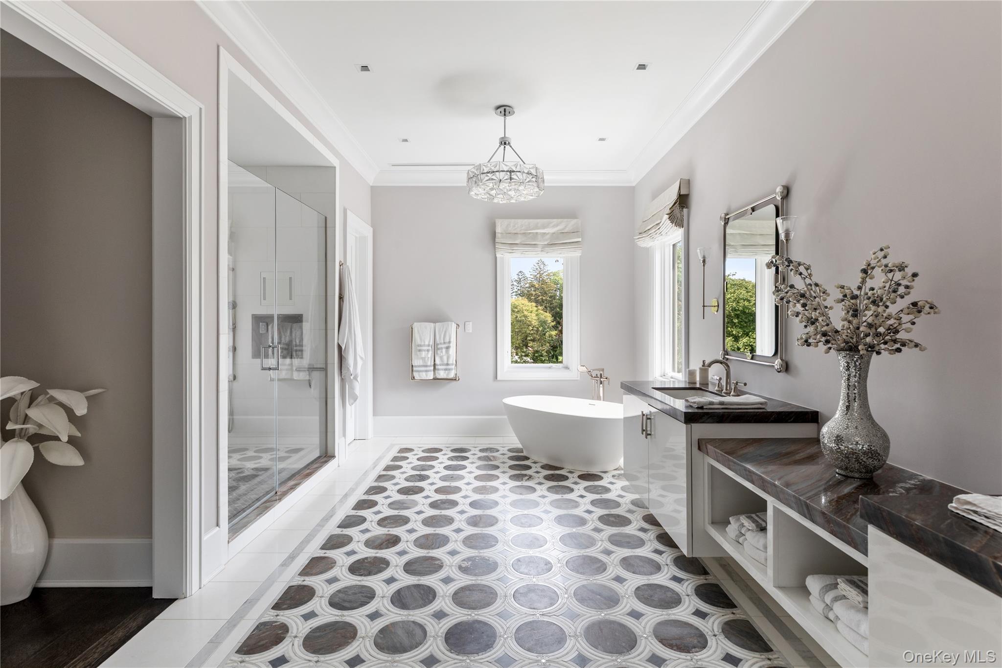 53 Simonson Road Glen Head, NY 11545 - Photo 26 of 43 a spacious bathroom with a double vanity sink a large mirror and a bathtub
