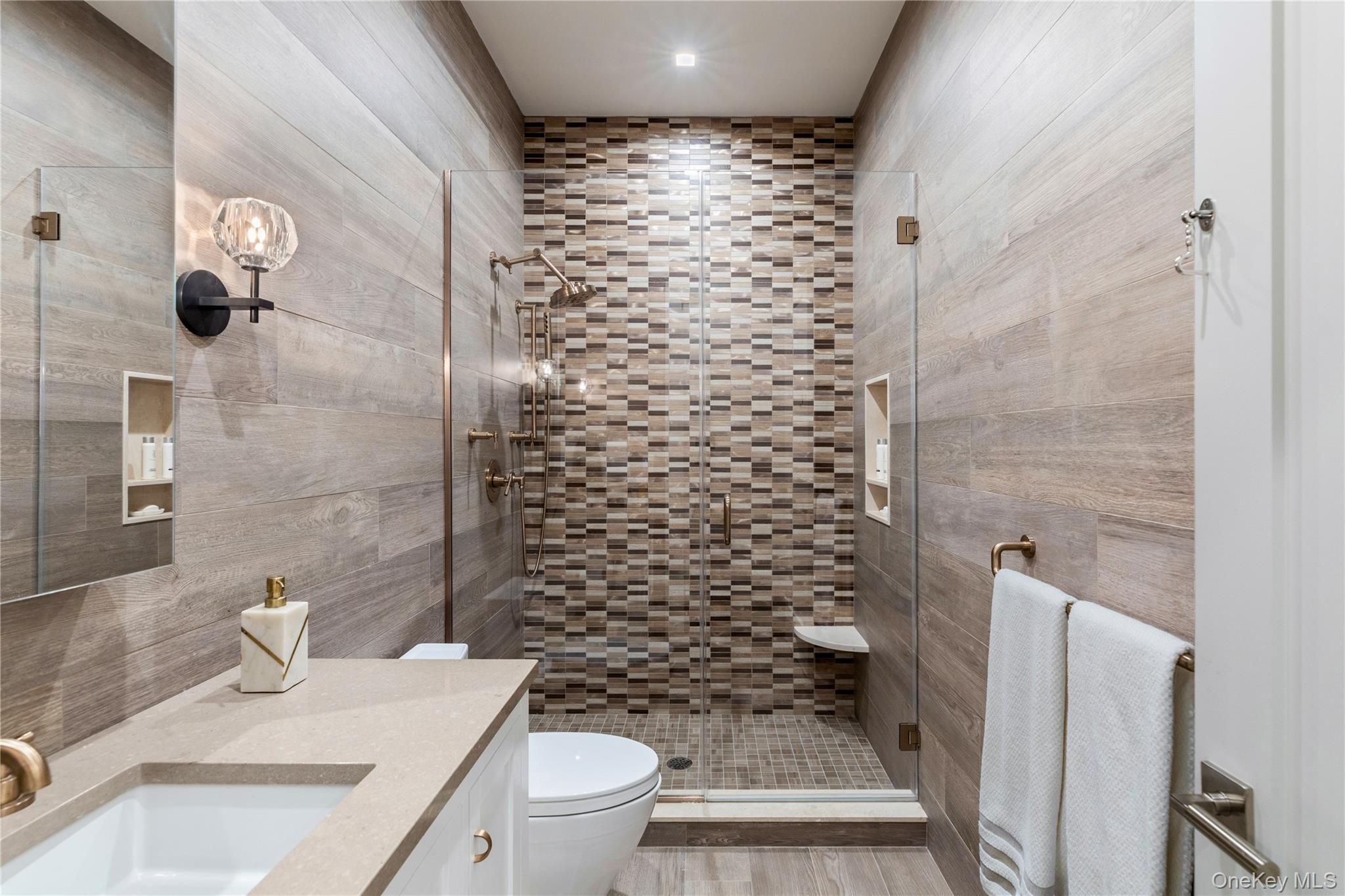 53 Simonson Road Glen Head, NY 11545 - Photo 35 of 43 a bathroom with a sink toilet and shower