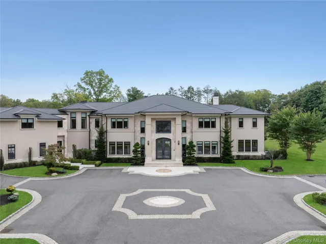 a living room filled with furniture and a potted plant