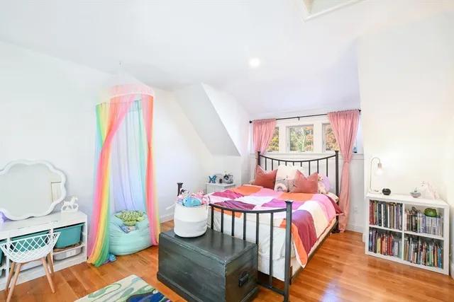 a bed room with a bed and a window